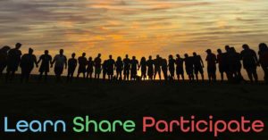 People standing holding hands with sun setting in background. Words Learn Share Participate can be seen