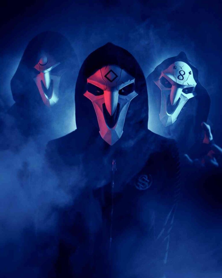 Nothing but Real band members in symbolic masks standing calmly in blue and red lighting for mobile format