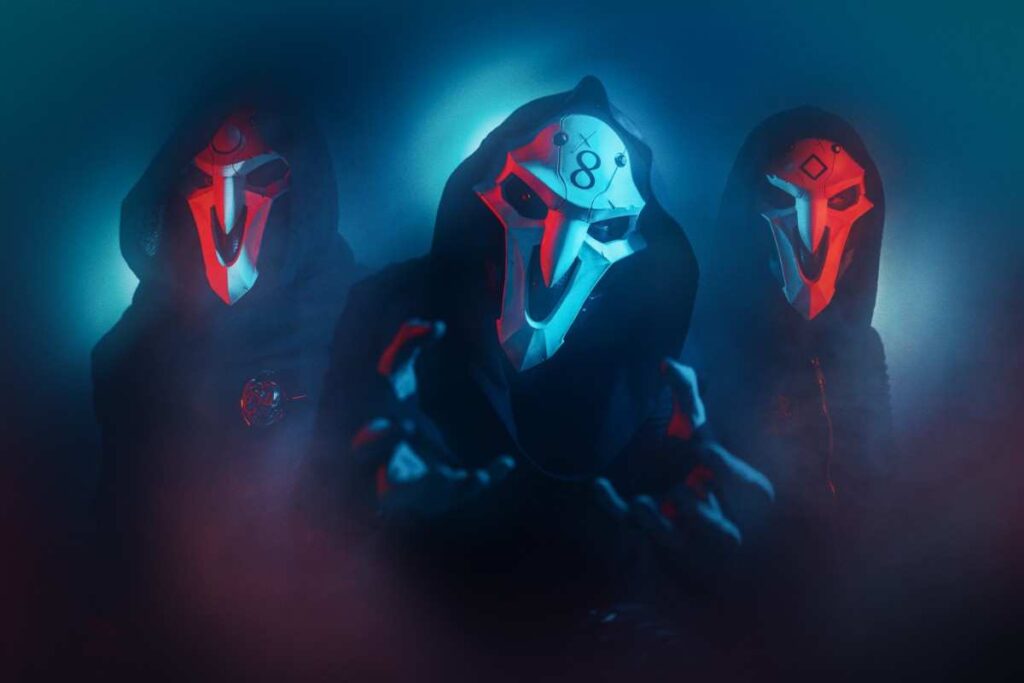 Band Nothing but Real wearing symbolic masks in blue and red lighting with misty atmosphere